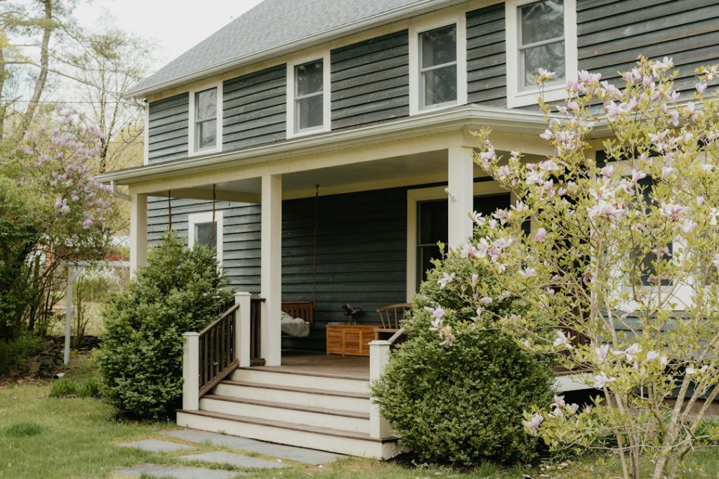 Welcoming home exterior with front porch, illustrative photograph