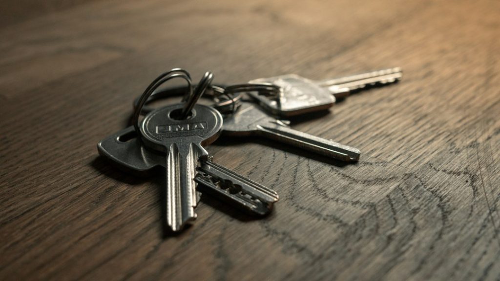 House keys resting on a wooden table